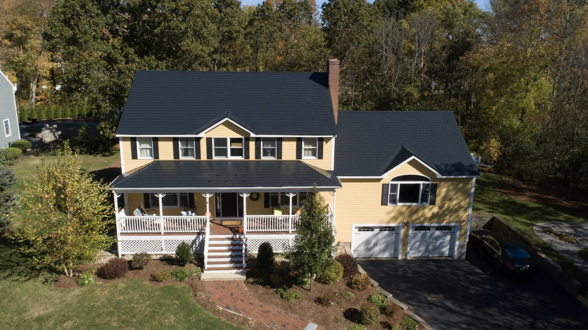 House in Reading, Massachusetts, with a black Interlock slate roof
